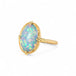 Gold ring with an Ethiopian opal stone on a white background