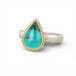 Silver and gold ring with a teardrop-shaped peruvian opal gemstone on a white background