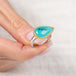 Handmade ring with peruvian opal stone held in hand