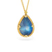 Gold necklace with a moonstone teardrop pendant on a white background