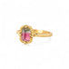 Gold ring with a watermelon tourmaline gemstone on a white background