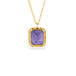 Gold necklace with a tanzanite gemstone pendant on a white background