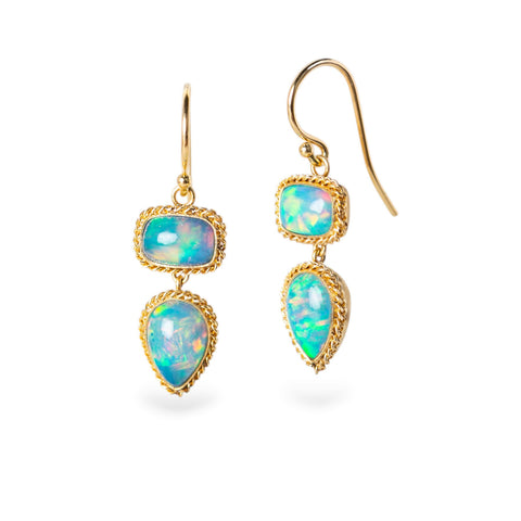 Gold earrings with Ethiopian opal on a white background