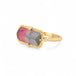 Handcrafted gold ring with a watermelon tourmaline gemstone and gold band on a white background