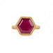 Gold ring with a hexagonal ruby gemstone on a white background