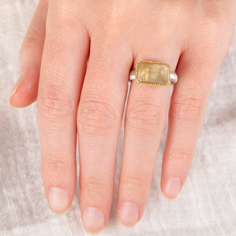 Handmade ring with rutilated quartz and 18k gold bezel and sterling silver band