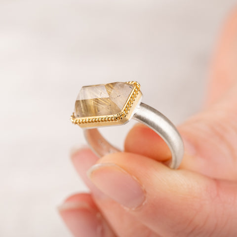 Handmade ring with rutilated quartz and 18k gold bezel and sterling silver band