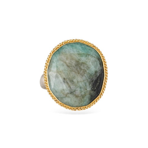 Emerald ring with a gold bezel and sterling silver band