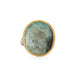Emerald ring with a gold bezel and sterling silver band