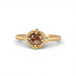 Gold ring with a brown diamond on a white background