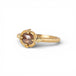 Gold ring with a brown diamond on a white background