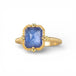 Gold ring with a tanzanite gemstone on a white background