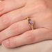 Gold ring with a spinel gemstone on a hand