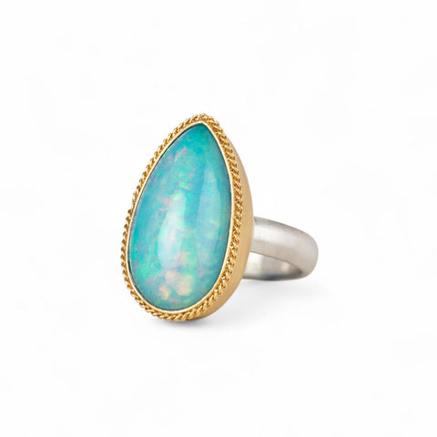 Ethiopian opal ring with 18k gold bezel and sterling silver band