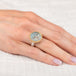 Silver and gold ring with topaz stone on a hand