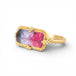 Gold ring with a colorful watermelon tourmaline gemstone on a white background