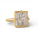 Gold ring with a dendritic quartz stone featuring natural inclusions on a white background