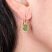 Andamooka opal earrings on a model