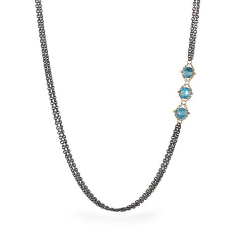 Asymmetrical necklace with London Blue Topaz close up