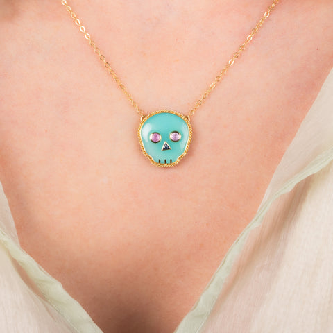 Blue opal skull necklace on model 