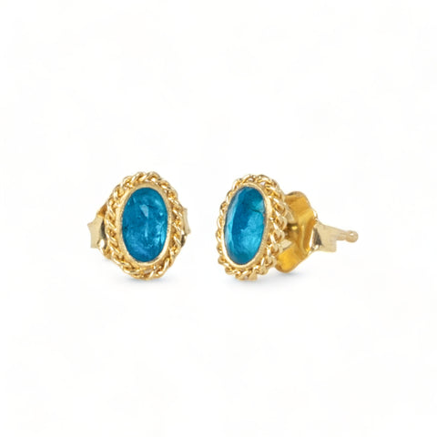 Blue tourmaline stud earrings on white background
