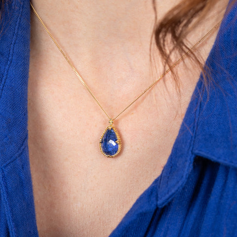 Tanzanite teardrop necklace on model side view