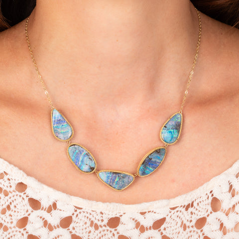 Boulder opal necklace on model close up