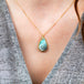 Boulder opal feather necklace on model