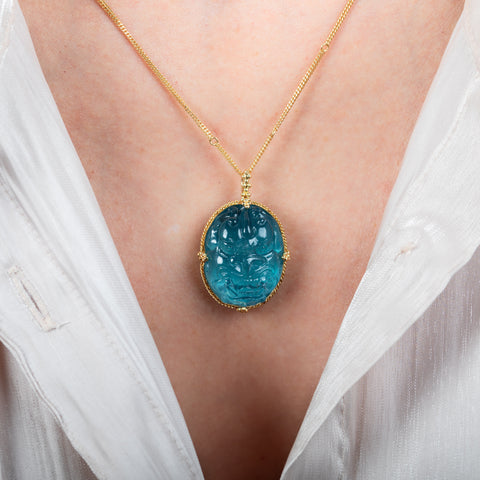 Carved dragon face aquamarine necklace on model