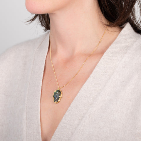 Carved labradorite on a model side view