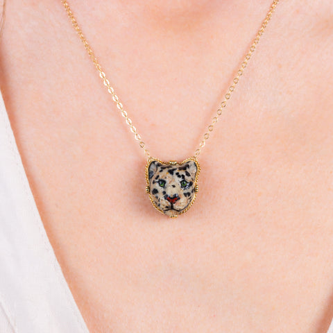 Caved leopard jasper necklace on a model.