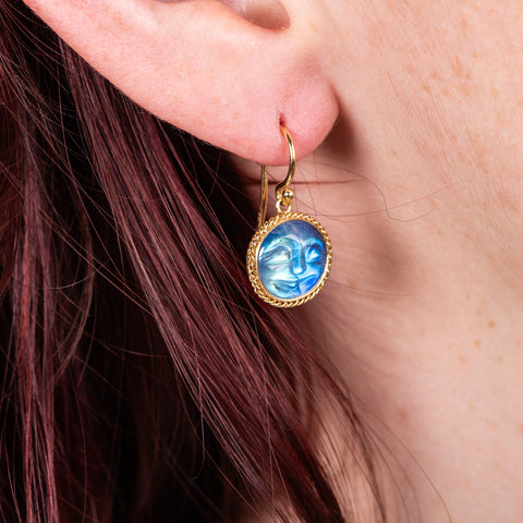 Carved moonstone earrings on model
