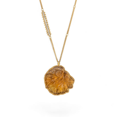 Carved citrine lion necklace with silver diamond embellishment on chain