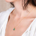Carved emerald leaf necklace side view