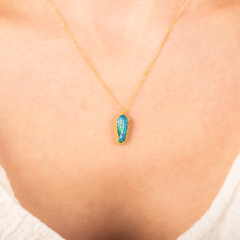 Carved ethiopian opal necklace on model