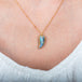 Boulder opal feather necklace on model