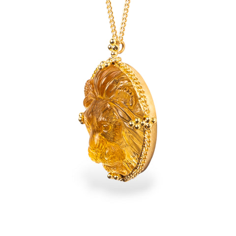 Carved lion necklace side view on white