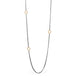 Oxidized silver necklace with 18k gold hoops on white background