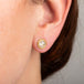 Diamond stud earrings on model