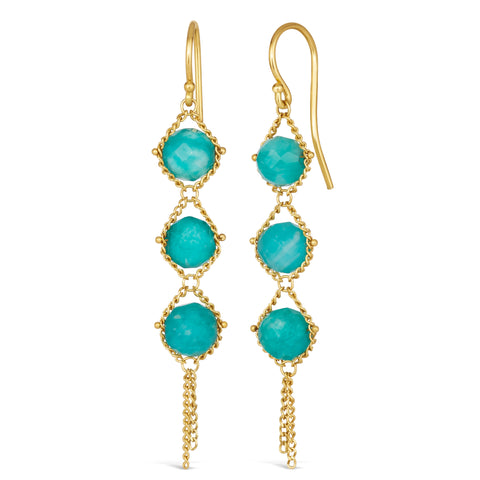 A pair of long 18k yellow gold earrings are crafted with blue amazonite beads suspended in delicate chain. The earrings are fastened with French hook closures.