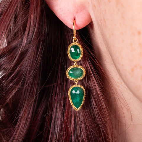 Emerald trio earrings on model