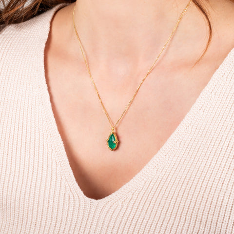 Emerald necklace on a model side view
