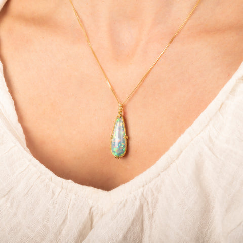 Ethiopian opal necklace on model side view