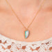 Ethiopian opal necklace on model close up