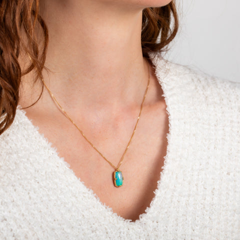 Ethiopian opal necklace on model side view