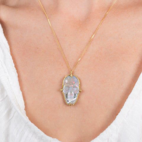 Ethiopian Opal skull necklace on a model