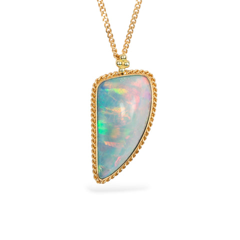 Ethiopian opal and gold necklace on white background