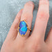 Boulder opal ring on a model