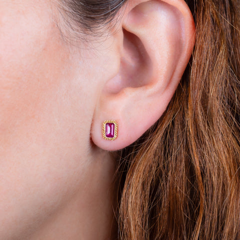 Ruby stud earrings on a model