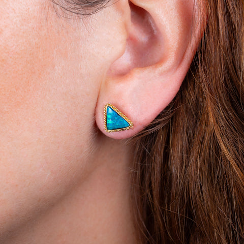 Boulder Opal earrings on a model